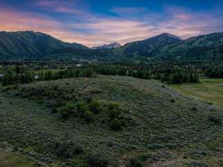 Experience breathtaking mountain views from this expansive property, perfect for building your dream home.