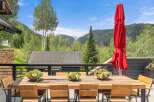 Enjoy breathtaking mountain views from this stunning outdoor dining area, perfect for al fresco meals.
