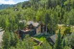 Experience luxury mountain living in this stunning contemporary home nestled amidst lush greenery.