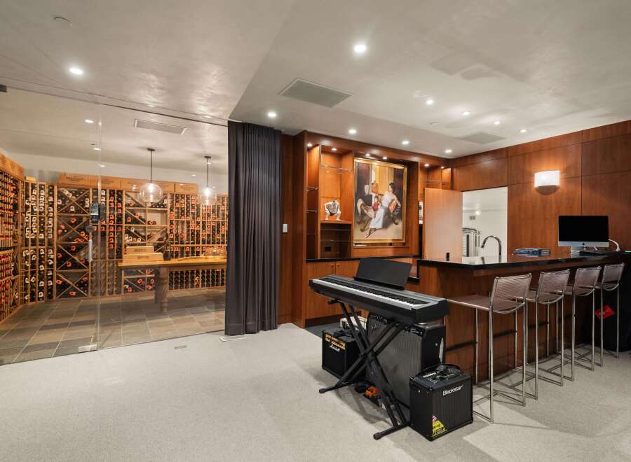 Experience luxury living with this stunning home featuring a climate-controlled wine cellar, perfect for the discerning collector.