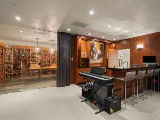 Experience luxury living with this stunning home featuring a climate-controlled wine cellar, perfect for the discerning collector.