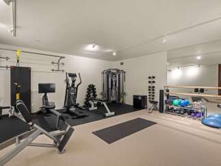 Transform your home into a personal fitness sanctuary with this fully equipped gym.