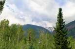 Escape to this stunning mountain property, offering breathtaking views of snow-capped peaks and lush green forests.