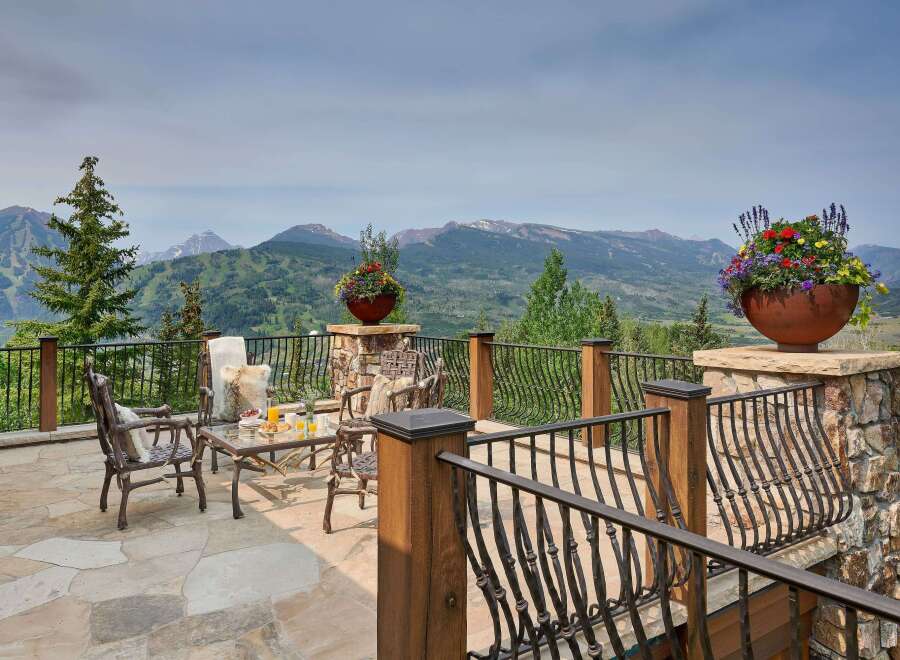 Experience breathtaking mountain views from this stunning patio, perfect for enjoying your morning coffee or evening cocktails.