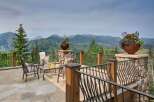 Experience breathtaking mountain views from this stunning patio, perfect for enjoying your morning coffee or evening cocktails.