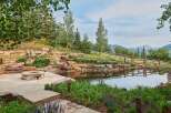 Experience luxury outdoor living with this stunning water feature and fire pit area, perfect for entertaining or quiet relaxation.