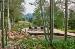 Experience serene mountain living with this stunning outdoor oasis, featuring a multi-level patio perfect for entertaining and relaxation.