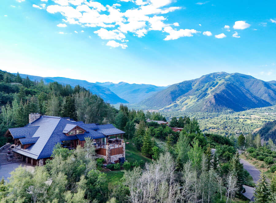 Experience luxury mountain living in this stunning estate, nestled amidst lush forests with breathtaking panoramic views of the valley and ski slopes.