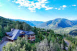 Experience luxury mountain living in this stunning estate, nestled amidst lush forests with breathtaking panoramic views of the valley and ski slopes.