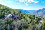 Experience luxury mountain living in this stunning estate, nestled amidst lush greenery and offering breathtaking panoramic views of the valley and surrounding peaks.