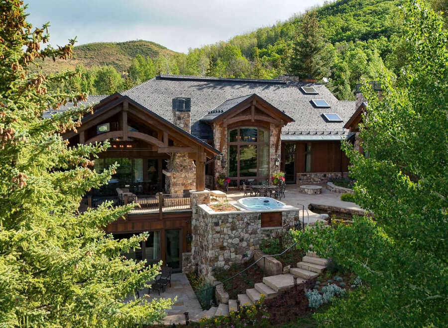 Experience luxury mountain living in this stunning estate, nestled amidst lush greenery and rolling hills.
