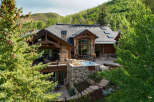 Experience luxury mountain living in this stunning estate, nestled amidst lush greenery and rolling hills.