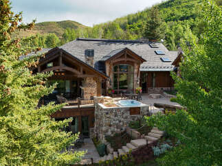 Experience luxury mountain living in this stunning estate, nestled amidst lush greenery and rolling hills.