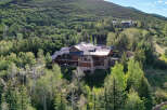 Nestled amidst a lush forest, this magnificent mountain estate offers unparalleled luxury and privacy.