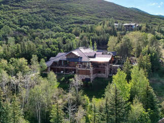 Nestled amidst a lush forest, this magnificent mountain estate offers unparalleled luxury and privacy.