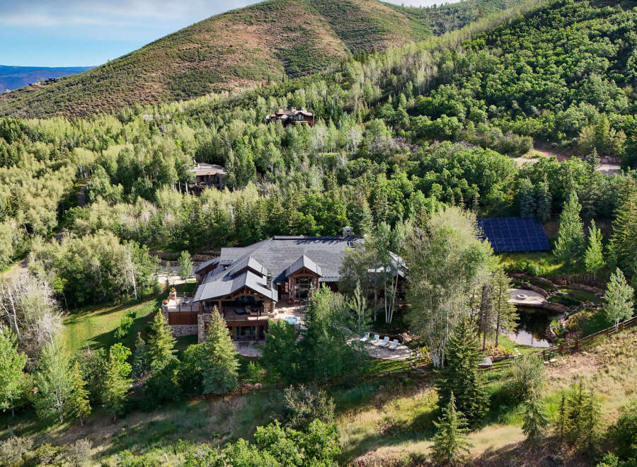 Experience luxury mountain living in this stunning estate nestled amidst lush greenery and rolling hills.