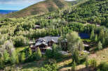 Experience luxury mountain living in this stunning estate nestled amidst lush greenery and rolling hills.