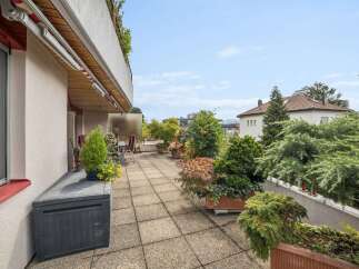 Enjoy outdoor living on this spacious balcony, perfect for relaxing and entertaining.