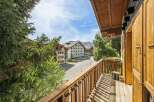Enjoy stunning mountain views from this charming balcony, perfect for your alpine getaway.