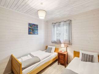 This charming bedroom features two cozy twin beds, perfect for guests or a family.