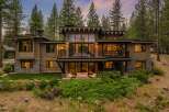 Experience luxury mountain living in this stunning modern home, nestled amongst towering pine trees.