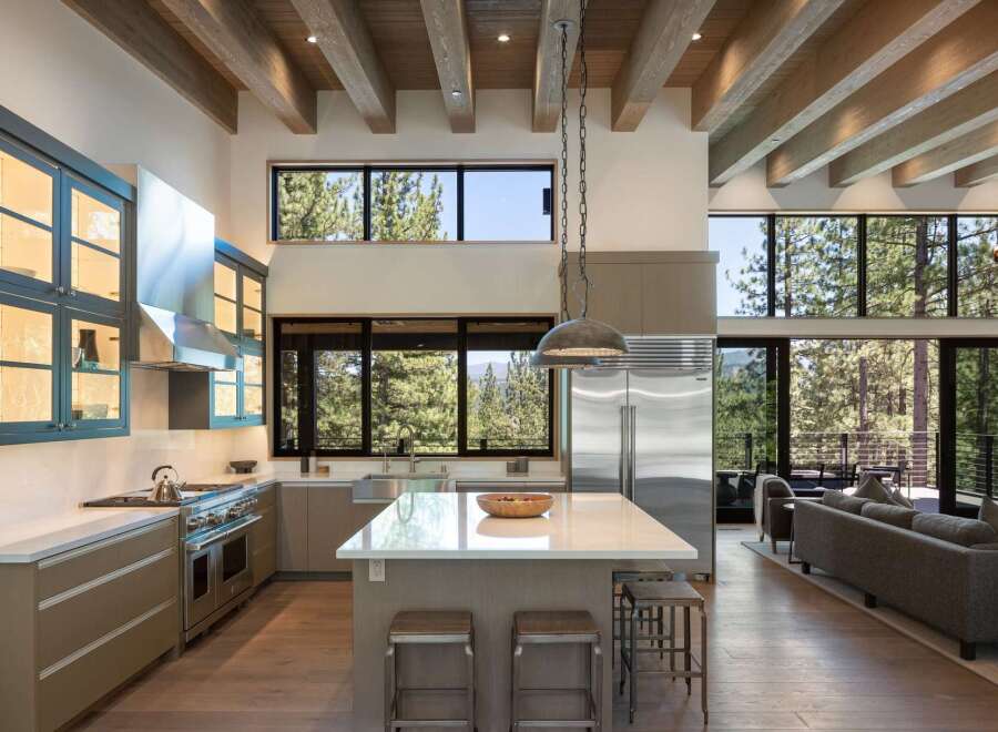 Experience modern mountain living in this stunning open-concept kitchen and living area.