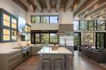 Experience modern mountain living in this stunning open-concept kitchen and living area.