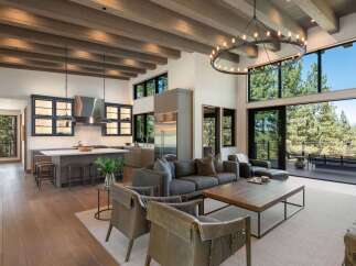 Experience luxurious mountain living in this stunning open-concept home, featuring a gourmet kitchen with custom cabinetry and a spacious living area perfect for entertaining.