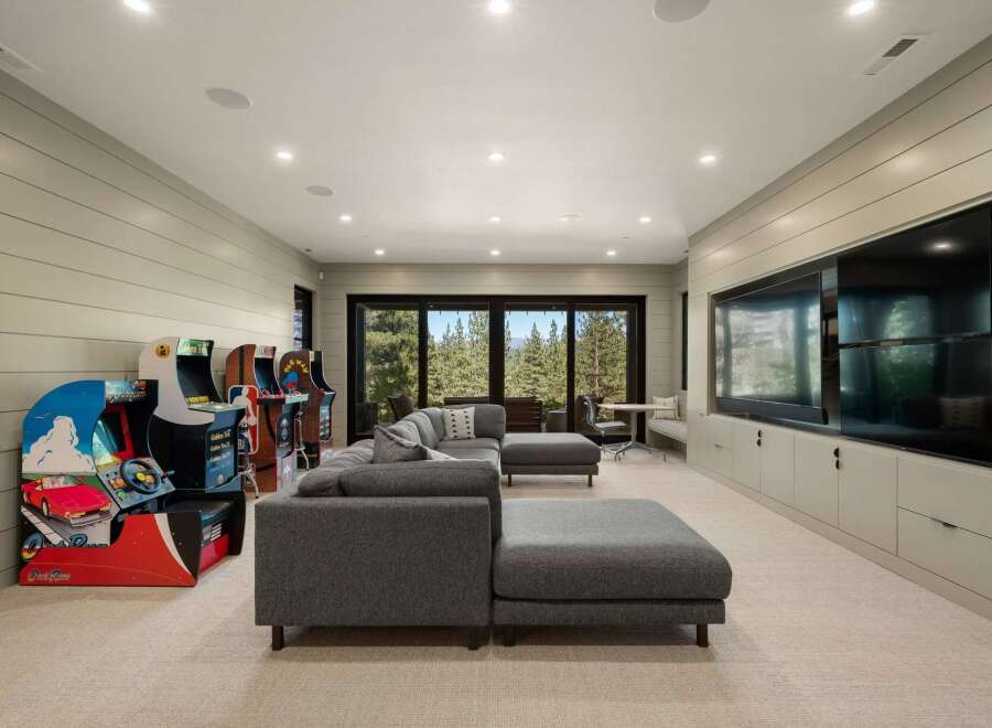 Step into this ultimate entertainment room, perfect for family fun and gaming nights.