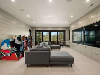 Step into this ultimate entertainment room, perfect for family fun and gaming nights.
