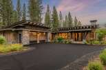 Experience modern mountain living in this stunning home, featuring a striking combination of natural wood and stone accents.