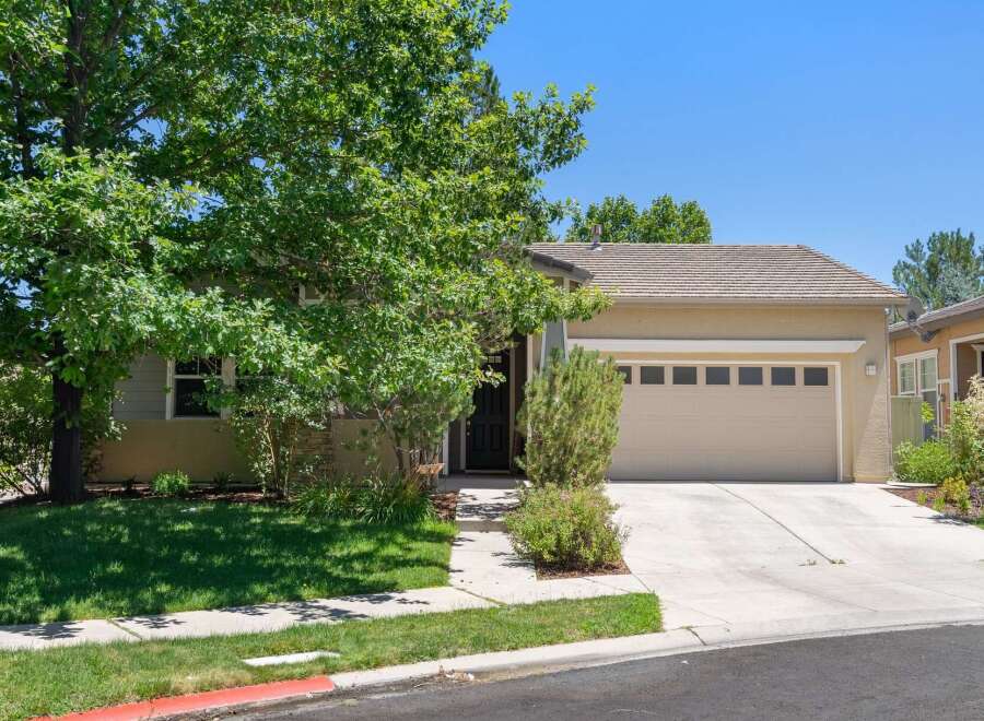 Discover this charming single-family home featuring a spacious two-car garage and a welcoming front entrance.