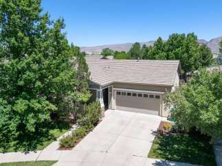 Discover this charming single-family home featuring a spacious two-car garage and a well-maintained driveway.