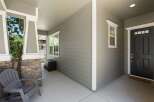 Welcome guests to this charming home with a covered front porch, perfect for enjoying the outdoors.