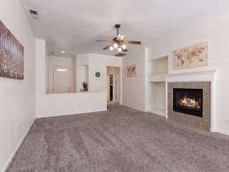 Step into this inviting living room, perfect for cozy evenings by the fireplace.