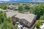 Discover this charming home featuring a spacious backyard with a relaxing hot tub and patio area, perfect for outdoor entertaining.
