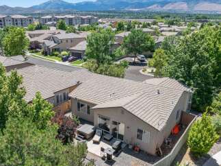 Discover this charming home featuring a spacious backyard with a relaxing hot tub and patio area, perfect for outdoor entertaining.