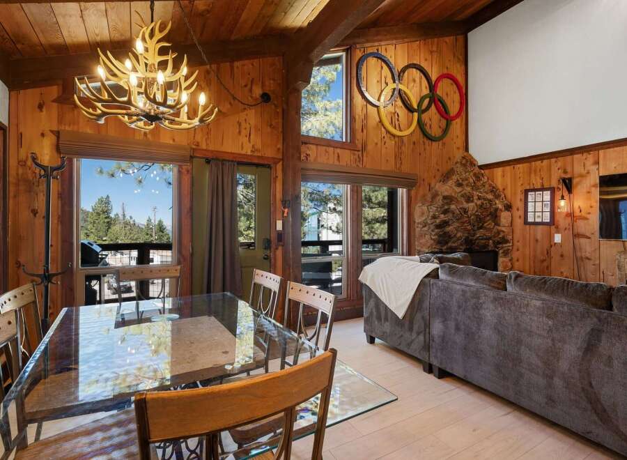 Experience rustic charm and mountain views in this inviting living and dining area.