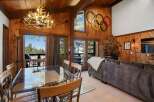Experience rustic charm and mountain views in this inviting living and dining area.