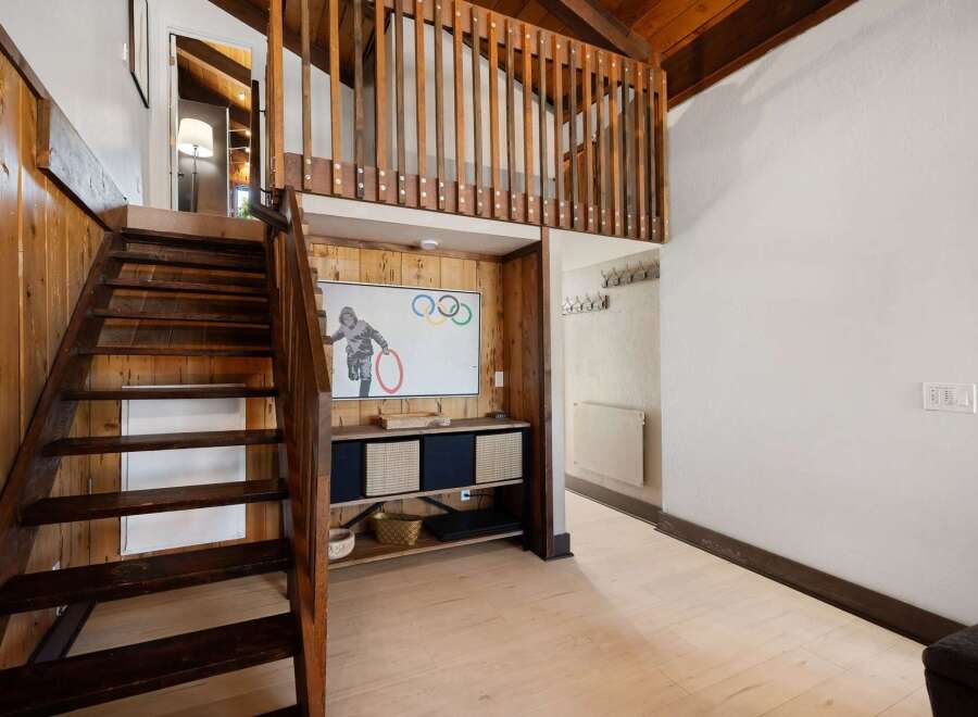 Ascend the charming wooden staircase to discover a unique loft space, perfect for relaxation or creative pursuits.