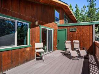 Enjoy the outdoors on this spacious wooden deck, perfect for relaxing or entertaining.