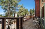 Enjoy breathtaking views from this charming wooden deck, perfect for morning coffee or evening relaxation.