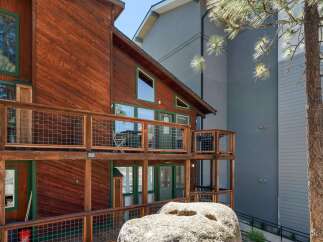 Experience mountain living in this charming wooden cabin, featuring multiple levels of private balconies perfect for enjoying the crisp air.