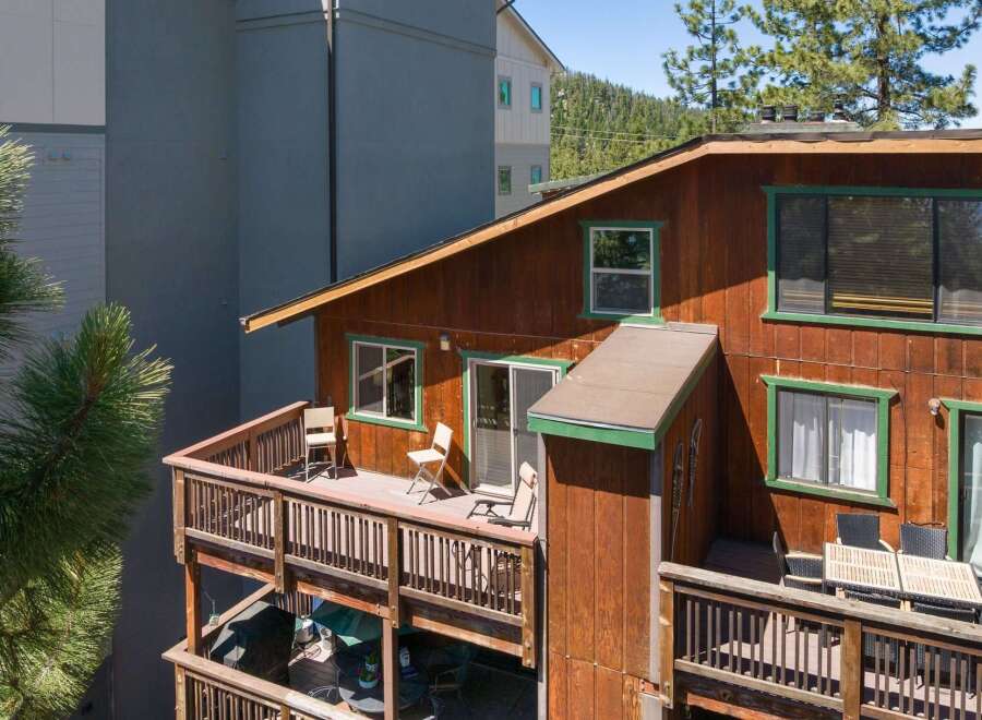 Enjoy outdoor living on this charming wooden deck, perfect for relaxing or entertaining.