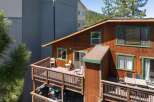 Enjoy outdoor living on this charming wooden deck, perfect for relaxing or entertaining.