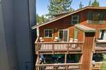 Experience outdoor living at its finest on the multi-level decks of this charming wooden home.