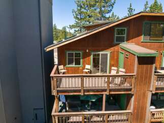 Experience outdoor living at its finest on the multi-level decks of this charming wooden home.
