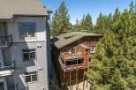 Experience mountain living in this charming wooden home, featuring multiple levels of expansive decks perfect for enjoying the surrounding pine forest.