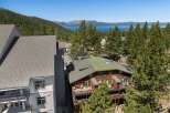 Experience breathtaking lake and mountain views from this stunning property, nestled amidst lush pine trees.