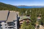 Experience breathtaking lake and mountain views from this stunning property, nestled amidst a lush pine forest.